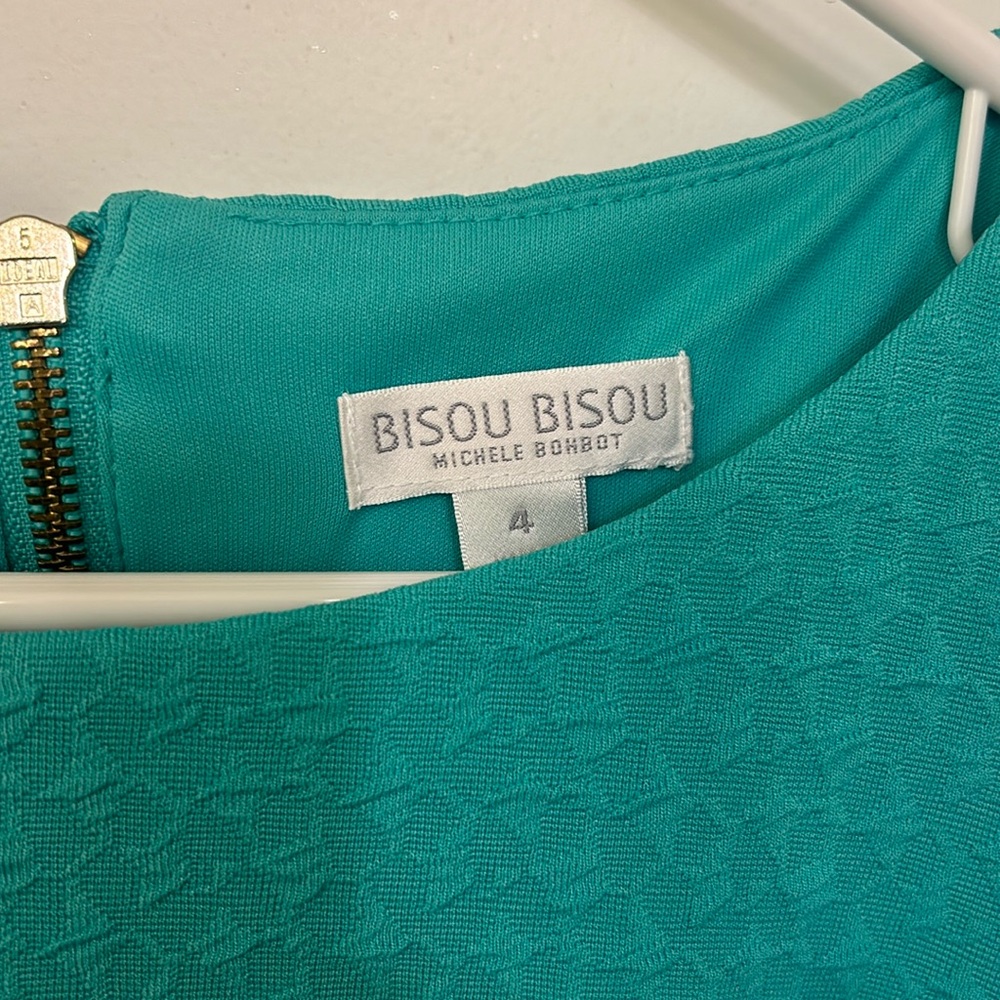 Mint green Bisou Bisou dress with ruching at side.